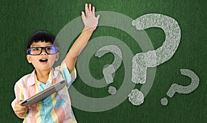 Boy raise his hand to ask question photo