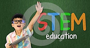 Boy raise his hand up for STEM education