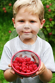 Boy with raspberries