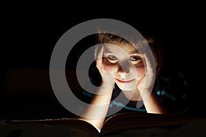 Boy reading bedtime story