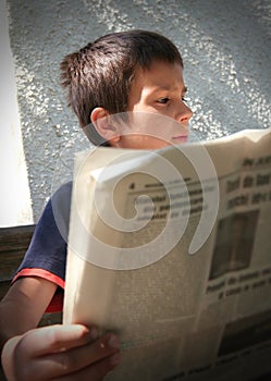 Boy Reading the News