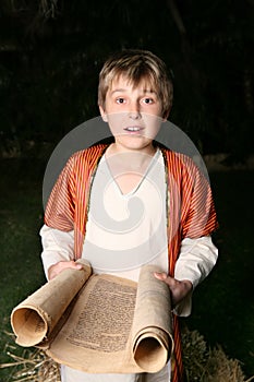 Boy reading a scroll