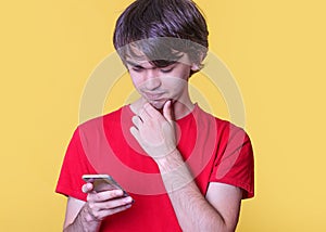 Boy in red shirt chating on phone