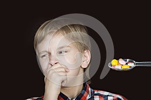 Boy refusing to take medicine