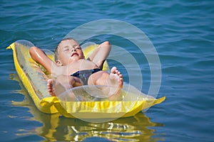 Boy relaxing on an inflatable mattress