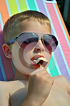 Boy relaxing on the sun bed