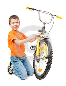 Boy repair bicycle isolated