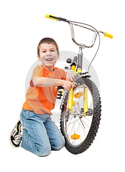 Boy repair bicycle isolated