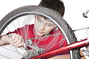 Boy repairing the bicycle