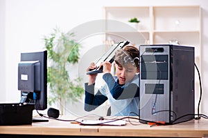 Boy reparing computers at workshop