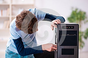 Boy reparing computers at workshop