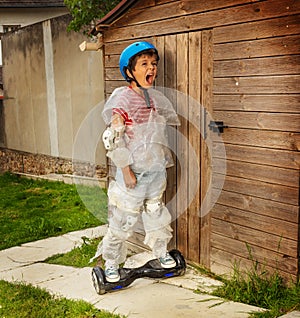 Boy ride hoverboard in super safe bubble wrap