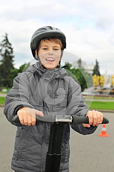 Boy ride on segway near friendship fountain photo