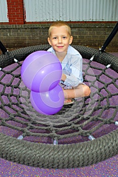 Boy ride on a swing