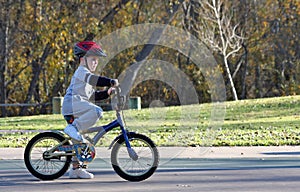 Boy riding bicycle at park