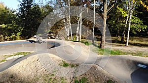 Boy riding a bicycle on a pumptrack