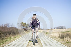 Boy riding a bike.