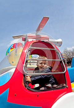 Boy riding carousel