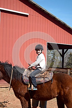 Boy riding horse