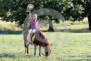 Boy riding pony horse