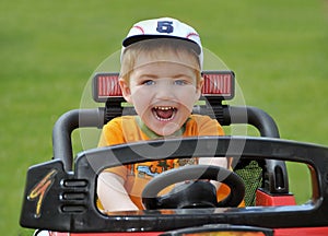 Boy riding racing car