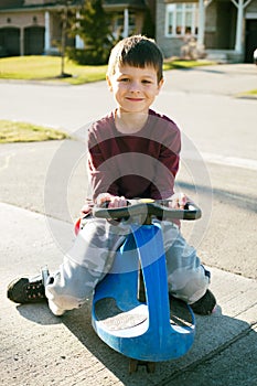 Boy riding scooter