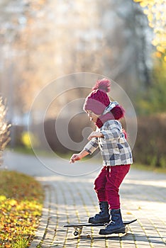 Boy riding a skateboard in the city park