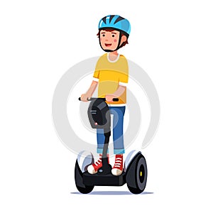 Boy riding a standing modern electric gyro scooter