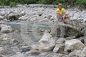 Boy at river Iupshara in Abkhazia