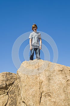 Boy on a rock at yoshua tree national park