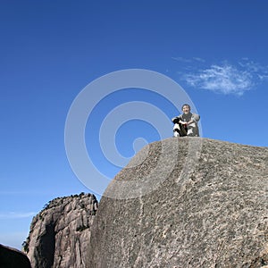 Boy on rocky mountain
