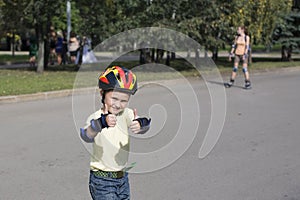 The boy on the roller blades.