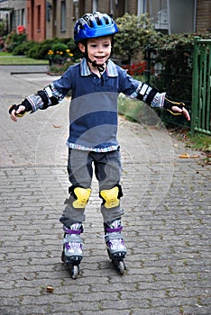 Boy with rollerblades photo