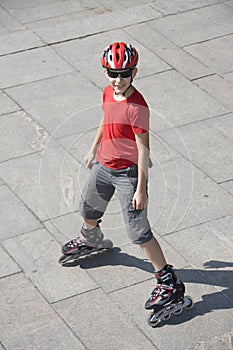 Boy on rollerblades photo