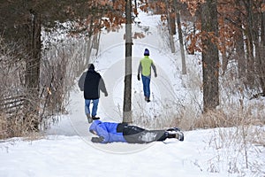 Boy Rolling down Snow Hill photo