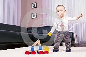 The boy in the room, playing with abandon.