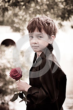 Boy with rose in his hand