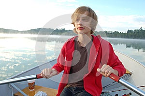 Boy Rowing A Boat