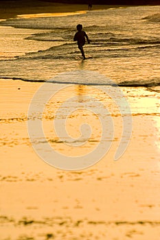 Boy Running at the beach