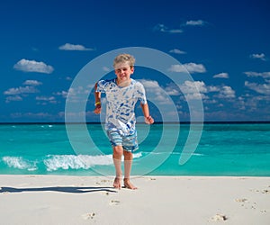 Boy running on beach