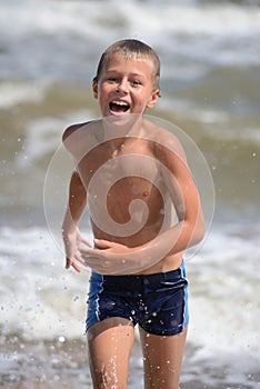 Boy running on the beach