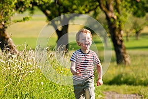 Boy running down a dirtpath