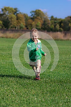 Boy running in field