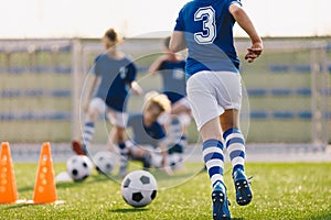 Boy Running on Grass Field in Soccer Cleats. Closeup image on Football Shoes