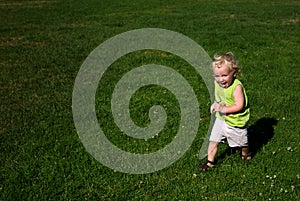 Boy Running on Grass in Park