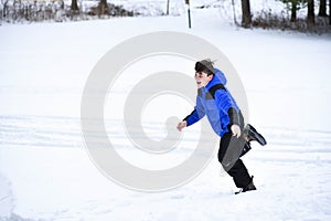 Boy Running Through Snow