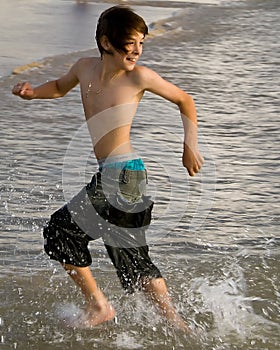 Boy Running with Tide photo