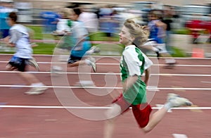 Boy running at track meet