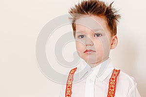 A boy in a Russian folk shirt