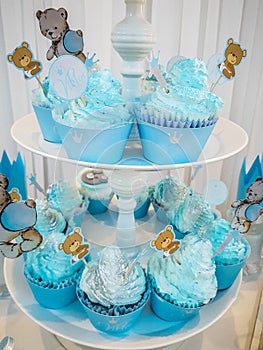 The boy`s birthday, blue, Birthday Boy Blue Party with Candy Presents and Cupcakes